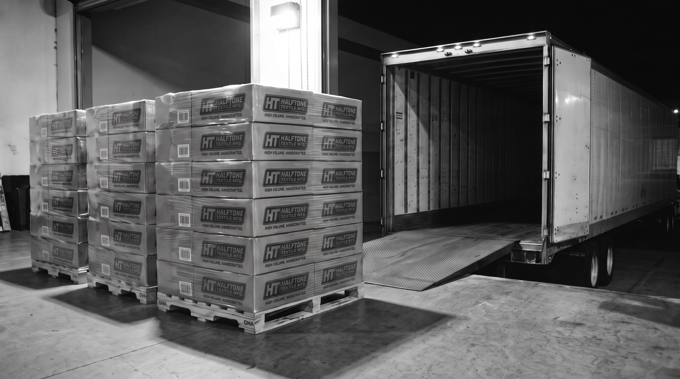 Three pallets stacked six high at an open trailer